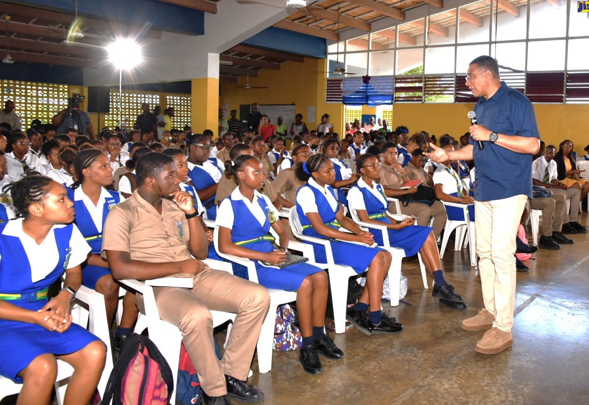 Prime Minister, the Most Hon. Andrew Holness, engages with students of Rusea's High School in Lucea, Hanover, during a visit to the secondary institution on Friday, January 19.