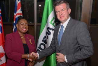 Minister of Culture, Gender, Entertainment and Sport Hon. Olivia Grange, greets World Anti-Doping Agency (WADA) President, Witold Banka, during the opening of WADA’s third Forum for Caribbean Sport Ministers on Tuesday (January 16) at the Jamaica Conference Centre in downtown Kingston. 