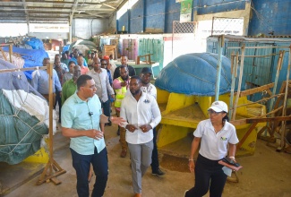 Prime Minister, the Most Hon. Andrew Holness (left), interacts with Deputy Mayor of Montego Bay, Councillor Richard Vernon (second left), during Monday’s (January 8) tour the Charles Gordon Market in Montego Bay, St. James.

