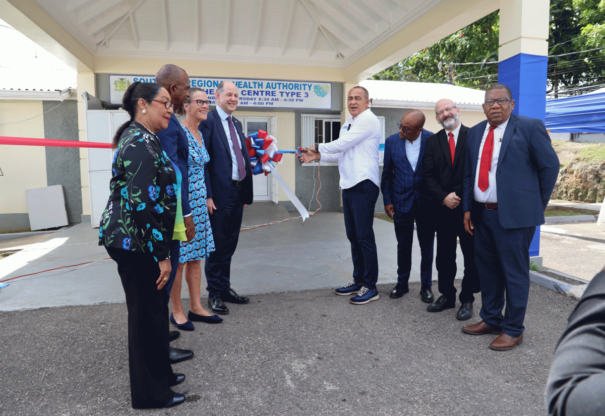 Minister of Health and Wellness, Dr. the Hon. Christopher Tufton (fourth right),  cuts the ribbon to signify the official handover of the upgraded Santa Cruz Health Centre in St. Elizabeth, on January 18.

