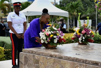 Minister of Culture, Gender, Entertainment and Sport, Hon. Olivia Grange, lays flowers at the shrine of National Hero and Jamaica’s first Prime Minister, the Right Excellent Sir Alexander Bustamante, on Saturday (February 24). The occasion was a floral tribute ceremony at National Heroes Park in Kingston marking the 140th anniversary of Sir Alexander’s birth.

