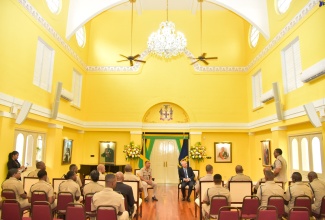 Governor-General, His Excellency the Most Hon. Sir Patrick Allen (right), listens keenly to an officer in the Jamaica Regiment Brigade, during a courtesy call at King’s House on Tuesday (February 20). Pictured (at left) is Brigade Commander, Colonel Mahatma E. Williams.

