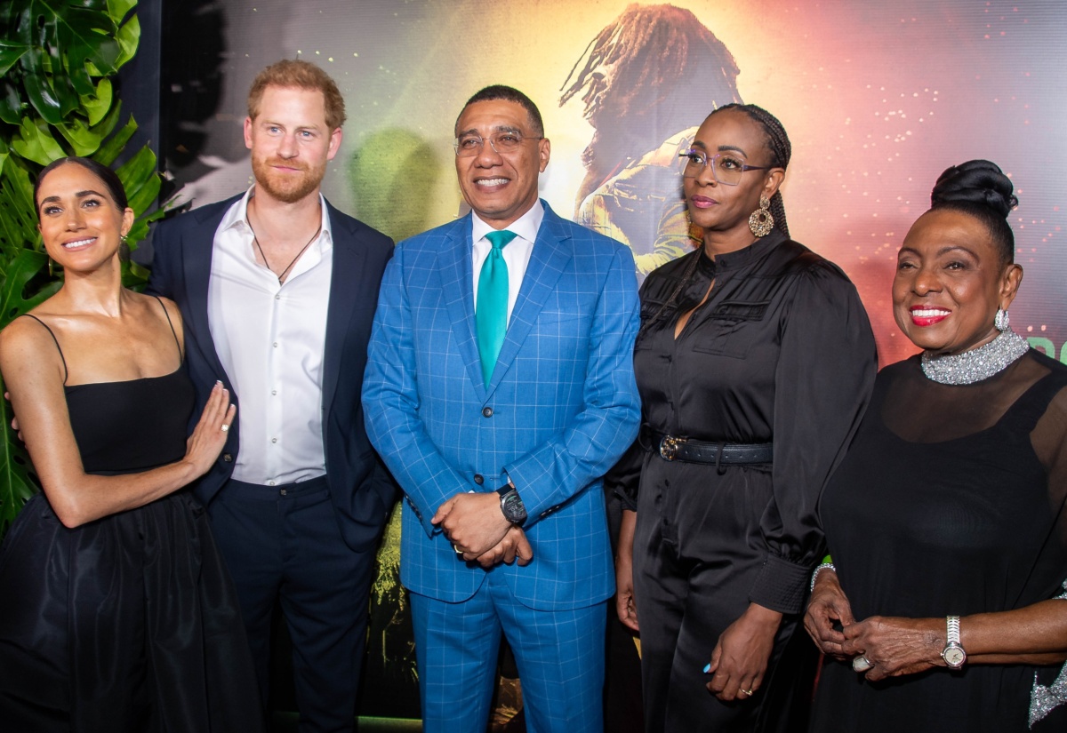 Prime Minister, the Most Hon. Andrew Holness (centre) and Mrs. Juliet Holness (second right), are joined by the Duke and Duchess of Sussex, Prince Harry (second left) and wife Meghan (left), and Minister of Culture, Gender, Entertainment and Sports, Hon. Olivia Grange (right), at the premiere of the Bob Marley movie, ‘One Love’, at Carib 5 in Kingston on January 23.   

