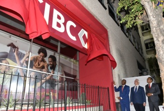 Minister of Finance and the Public Service, Dr. the Hon. Nigel Clarke (left), unveils the new logo for CIBC FirstCaribbean during Wednesday’s (January 31) rebranding launch at the bank’s headquarters on Knutsford Boulevard in New Kingston. Looking on are CIBC Canada’s Executive Vice President for Purpose, Brand and Corporate Affairs, Stephen Forbes (centre), and CIBC FirstCaribbean Managing Director, Nigel Holness.

