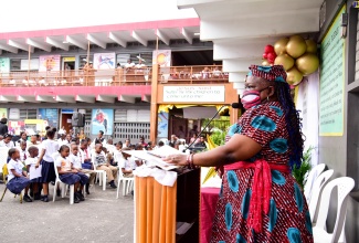 Senior Education Officer at the Ministry of Education and Youth, Dr. Lorna Thompson, delivers the keynote address at the Half-Way Tree Primary School in St. Andrew, where 91 students were honoured for perfect attendance at classes over the past 100 days, today (February 12).

