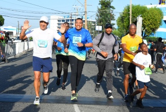  Prime Minister the Most. Hon. Andrew Holness (second left) and Minister of Health and Wellness, Dr. the Hon. Christopher Tufton participate in the 26th staging of the Sagicor Sigma ‘Honour’ Run in Kington on Sunday (February 18).