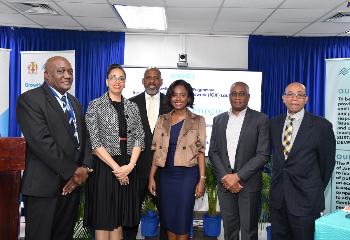 Senior Director, Economic Planning and Research Division, Planning Institute of Jamaica (PIOJ), James Stewart (left) with (from second left) Director of the Growth Inducement Programme at the PIOJ, Laura Levy; Director General of the PIOJ, Dr. Wayne Henry; Economic Specialist at the PIOJ, Kellie-Ann Murray;  Partner at PricewaterhouseCoopers (PwC), Adrian Tait; and renowned development expert and Adjunct Professor in Economics, Climate Change and Renewable Energy at the University of Technology, Dr. Wesley Hughes, at the launch of the PIOJ’s Inclusive Growth Index Framework on February 8 in Kingston.

