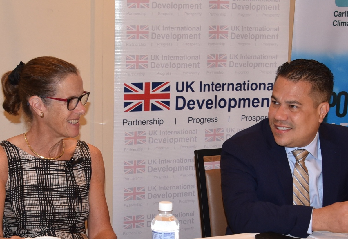 Minister without Portfolio in the Ministry of Economic Growth and Job Creation, Senator the Hon. Matthew Samuda, in discussion with British High Commissioner to Jamaica, Her Excellency Judith Slater, at the launch of the ‘Regional Climate Finance Programme: Small Island Developing States Capacity and Resilience (SIDAR) Programme for the Caribbean’, today (February 20), at the ROK Hotel in downtown Kingston.