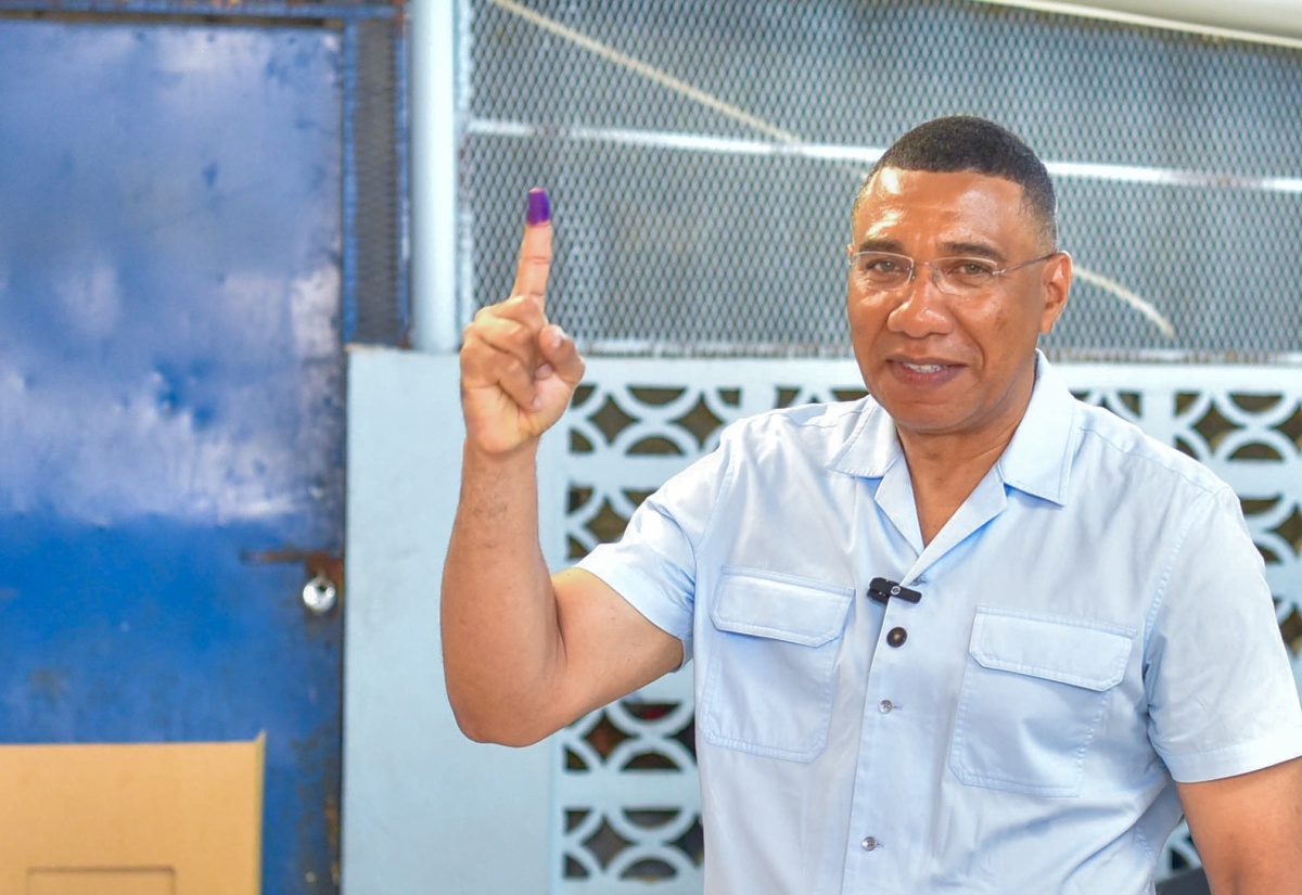 Prime Minister, the Most Hon. Andrew Holness, shows off his inked right index finger after casting his ballot in the 2024 Local Government elections at the Mona High School in Eastern St. Andrew on February 26.

