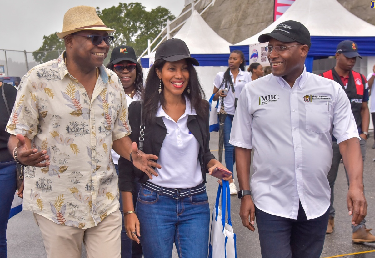 Minister of Tourism, Hon. Edmund Bartlett  (left), with Director, Tourism Linkages Network, Carolyn McDonald Riley; Chair of the Gastronomy Network, Nicola Madden-Greig and Minister of Industry Investment and Commerce, Senator the Hon. Aubyn Hill, at the seventh staging of the Jamaica Blue Mountain Coffee Festival, held at the Newcastle grounds in St. Andrew on March 2.

