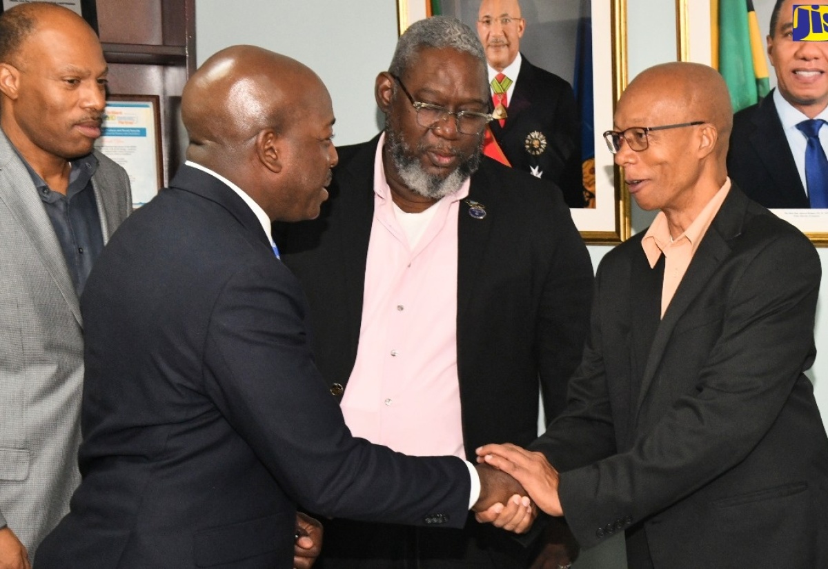 Minister of Labour and Social Security, Hon. Pearnel Charles Jr. (second left), greets President of the Caribbean Congress of Labour, André Lewis (right), during a courtesy call at the Ministry’s North Street offices in Kingston on Wednesday (March 6). Others (from left) are President, Jamaica Confederation of Trade Unions (JCTU), St. Patrice Ennis and Vice President, Bustamante Industrial Trade Union (BITU), Rudolph Thomas.


