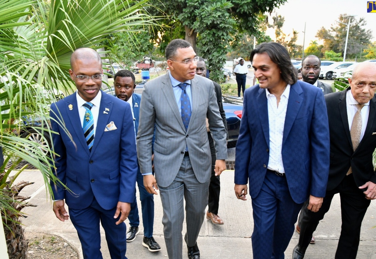 Prime Minister, the Most Hon. Andrew Holness (second left), in dialogue with Founder and Chief Executive Officer, Amber Group, Ambassador Dushyant Savadia, on arrival for the launch of the Amber UTech Launchpad at the University of Technology (UTech) campus in Papine, St. Andrew, on March 6. Accompanying them are President of  UTech, Dr. Kevin Brown (left) and Pro Chancellor of UTech, Aldrick McNab (right).

