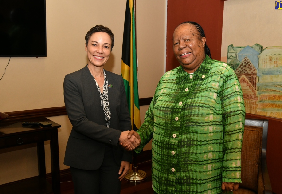South Africa’s Minister of International Relations and Cooperation, Dr. Grace Naledi Mandisa Pandor (right), is welcomed to the island by Minister of Foreign Affairs and Foreign Trade, Senator the Hon. Kamina Johnson Smith, on her arrival at the Norman Manley International Airport on Wednesday, March 20. 

