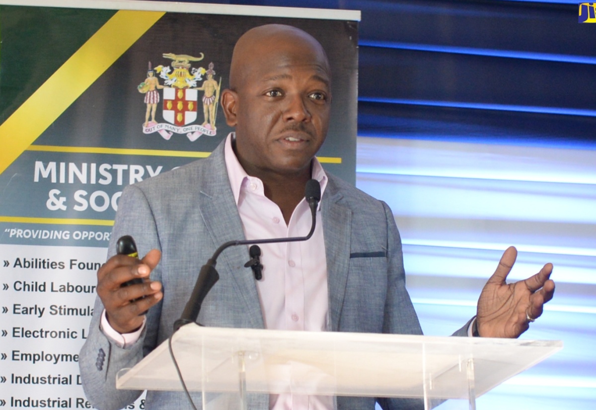 Minister of Labour and Social Security, Hon. Pearnel Charles Jr., delivers his opening remarks during the third ‘On the PATH to Transformation’ town hall meeting in Portmore, St. Catherine, on March 27.

