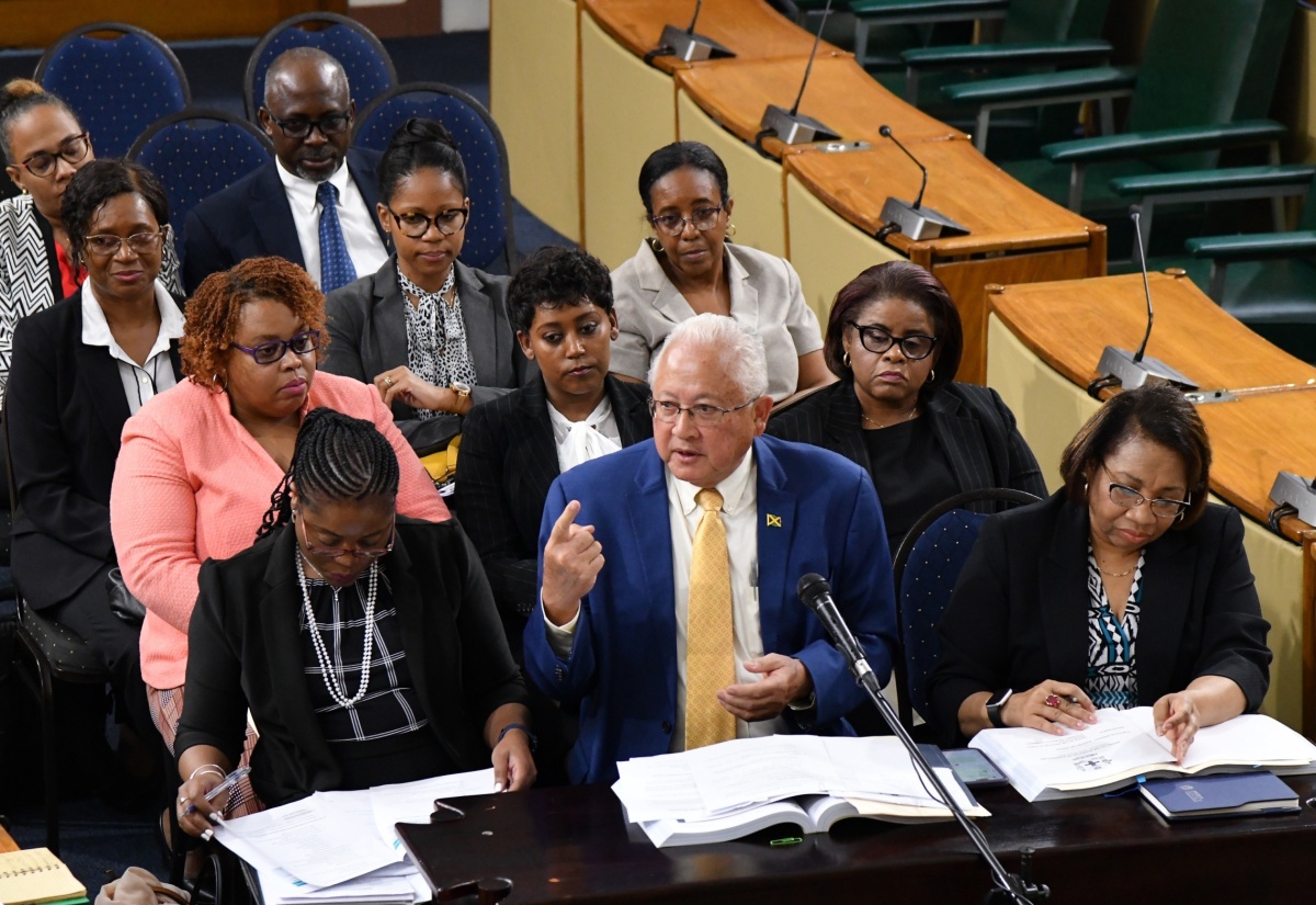 Justice Minister, Hon. Delroy Chuck (centre, front row), speaks during Tuesday’s (March 5) meeting of the Standing Finance Committee of the House of Representatives meeting at Gordon House. At right is Permanent Secretary in the Ministry, Grace-Ann Stewart McFarlane. 