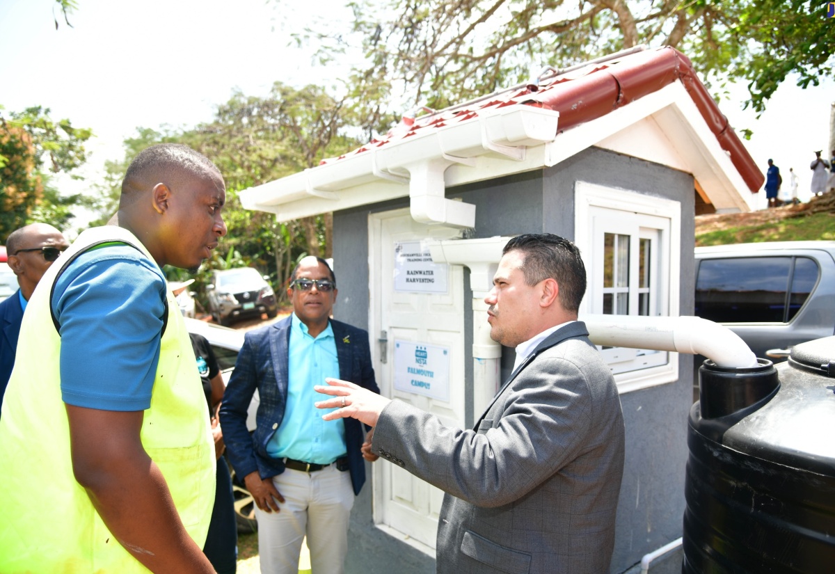 Minister without Portfolio in the Ministry of Economic Growth and Job Creation, Senator the Hon. Matthew Samuda (right), shares in conversation with (from left) General Construction Instructor, Beechamville Vocational Training Centre, Daniel Rose and Minister of State in the Ministry of Labour and Social Security, Dr. the Hon. Norman Dunn, at the World Water Day Expo held at the Marymount High School, St. Mary, on March 22.


