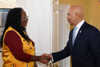 Governor-General, His Excellency the Most Hon. Sir Patrick Allen, greets Lions Club International Jamaica Region 4 Chair, Leo Club Advisory Panellist and Administrative Officer, Ava-Loi Forbes, during her courtesy call at King’s House on March 1.

