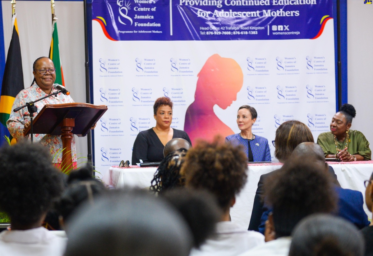  Minister of Culture, Gender, Entertainment and Sport, Hon. Olivia Grange (seated right); and Minister of Foreign Affairs and Foreign Trade, Senator the Hon. Kamina Johnson Smith, (seated second right), listen as South Africa’s Minister of International Relations and Cooperation, Her Excellency Dr. Grace Naledi Mandisa Pandor, addresses students and officials of the Women’s Centre of Jamaica Foundation (WCJF), during a visit to the Centre’s headquarters in Kingston on Thursday (March 21). Also at the head table is Chair, WCJF Board of Directors, Debby-Ann Brown Salmon.

