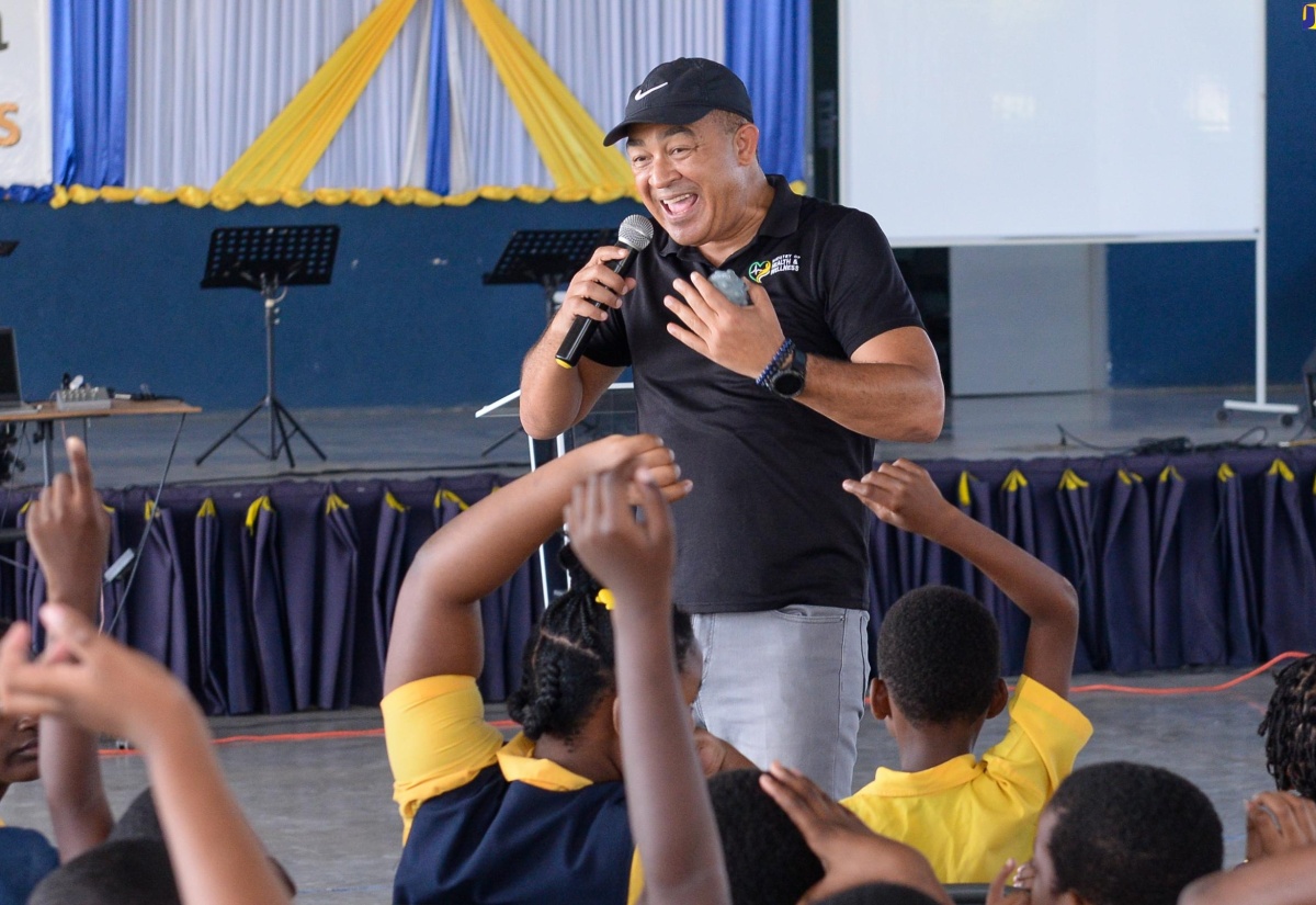 Minister of Health and Wellness, Dr. the Hon. Christopher Tufton, engages with students at Christel House Jamaica, during a wellness check-In at the institution in St. Catherine on Wednesday (March 13), as part of the Ministry’s #DoYourShare mental wellness campaign.

