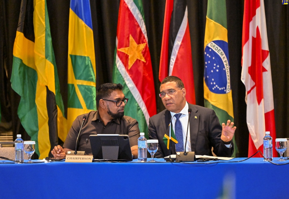 Prime Minister, the Most Hon. Andrew Holness (right), is in conversation with CARICOM Chairman and President of Guyana,  Dr. Mohamed Irfaan Ali, during a press conference at The Jamaica Pegasus hotel today (March 11) on the occasion of a high-level CARICOM meeting on Haiti.