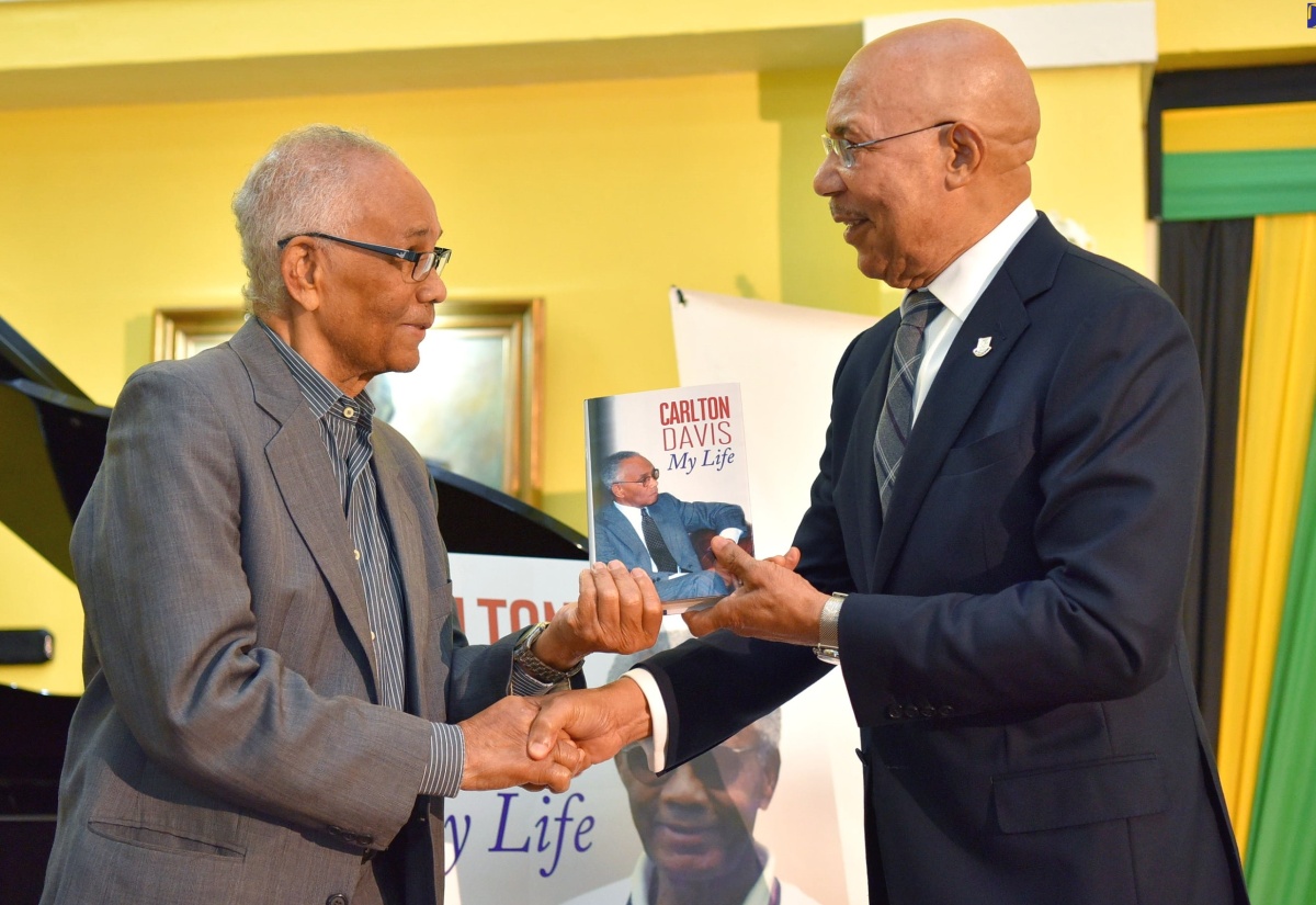 Governor- General, His Excellency the Most Hon. Sir Patrick Allen (right) is presented with a copy an autobiography entitled ‘My Life’ by former Cabinet Secretary, Dr. Carlton Davis, at a book launch held on March 7 at King’s House.

 