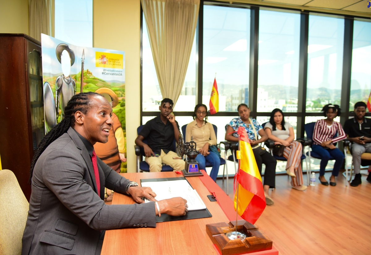 State Minister for Foreign Affairs and Foreign Trade, Hon. Alando Terrelonge, speaks to students from the University of the West Indies (UWI) Mona Spanish Programme during a World Book Day event held on Tuesday (April 23) at the Embassy of Spain in New Kingston.
