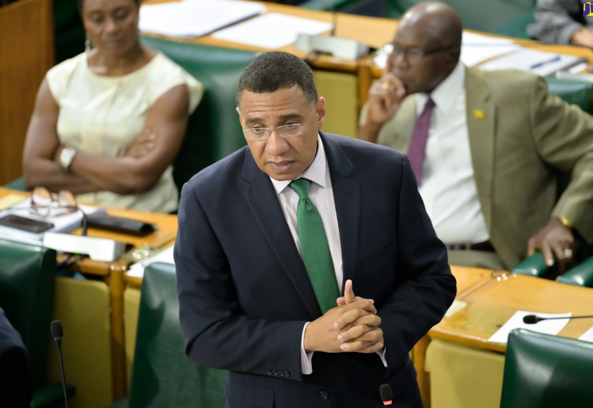 Prime Minister, the Most Hon. Andrew Holness, hails former Clerk to the Houses of Parliament, Valrie Curtis, for almost 30 years of yeoman service, during the sitting of the House of Representatives on April 23. 