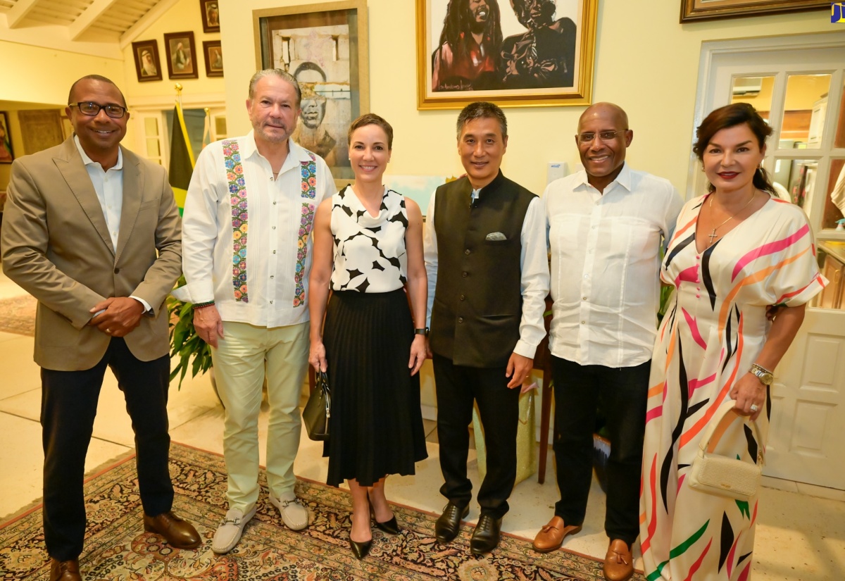 Minister of Foreign Affairs and Foreign Trade, Senator the Hon. Kamina Johnson Smith (third left), and Senator the Hon.  Aubyn Hill (second right), share a moment with High Commissioner of India to Jamaica, His Excellency Masakui Rungsung (third right), at a farewell dinner for the High Commissioner held in Cherry Gardens, St. Andrew on Thursday (April 25). Also in attendance (from left) are:  Jason Smith, the husband of Senator Johnson Smith; President of the Upper House, Senator Tom Tavares Finson and his wife, Rose Tavares Finson.

