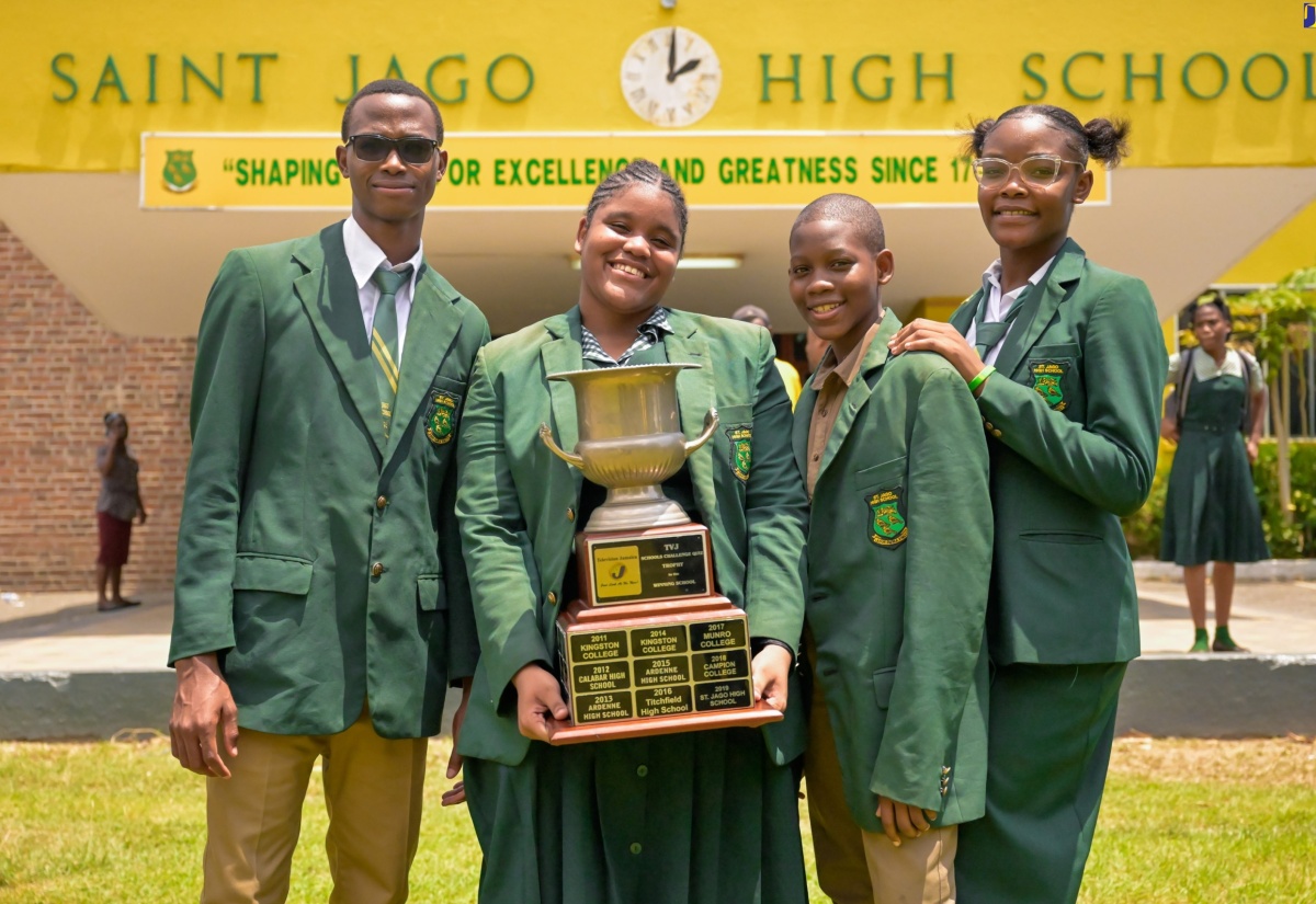 The St. Jago High School team proudly display their winning trophy in the 2024 Schools’ Challenge Quiz competition, at a celebratory gathering held on Monday (April 8) at the school's Monk Street premises in Spanish Town, St Catherine. The members of the team (from left) are Jermaine Miller, Jhanielle Esson (captain), Nathaniel Baker and Kevandra Blake. St. Jago secured victory against Calabar High School with a score of 37-33 in the competition finals held on April 5, securing the title for the third consecutive year.

