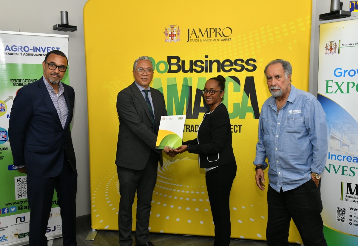 Chief Executive Officer (CEO), Agro-Investment Corporation (Agro-Invest), Vivion Scully (second left); and President, Jamaica Promotions (JAMPRO), Shullette Cox (second right), display the signed Memorandum of Understanding (MOU), which will strengthen collaboration between the entities to promote growth in investment and export of agribusiness products. Sharing the moment are Chairman of the Board of Directors, Agro-Invest, Ian Murray (left), and Deputy Chairman, JAMPRO, Ian Levy. The signing ceremony was held on April 4 at JAMPRO’s corporate offices in Kingston.