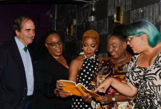 Minister of Culture, Gender, Entertainment and Sport, Hon. Olivia Grange (second right), along with (from left) Ambassador of Mexico to Jamaica, His Excellency Juan José González Mijares; Opposition Spokesperson on Culture and Creative Industries, Dr. Deborah Hickling; Professor Donna Hope; and pioneering Dancehall Queen, Carlene Smith, peruse the book titled ‘Dancehall Queen: Erotic Subversion’ at the launch at the Marketplace Entertainment Centre for the Arts in Kingston on April 18. The book, which is edited by Professor Hope and Mexican, Carla Lamoyi, looks at the Jamaican and international Dancehall Queen culture.

