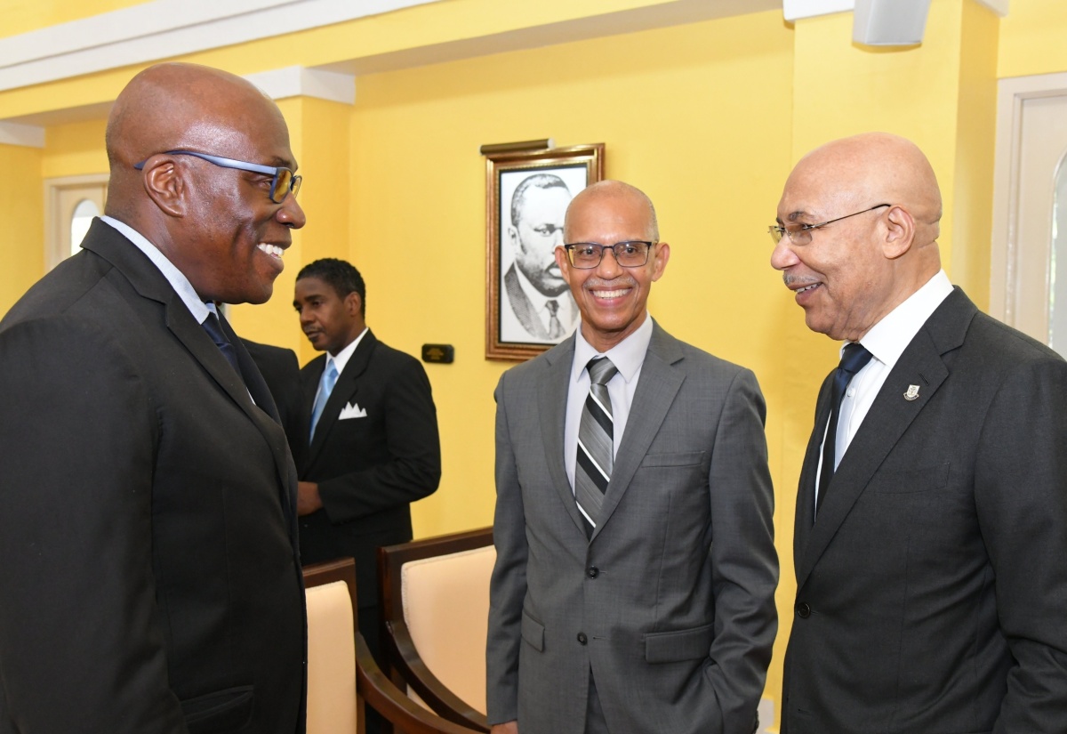 Governor-General, His Excellency the Most Hon. Sir Patrick Allen (right); President of the Court of Appeal, Hon. Justice Patrick Brooks (centre) and Chief Justice, Hon. Bryan Sykes, exchange pleasantries during a swearing-in ceremony, held at King’s House on April 3, for eight members of the judiciary who were appointed to act in higher office for the Easter Term.

