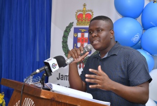 Sub-Officer in Charge of the JamaicaEye St. Catherine Monitor Centre, Corporal Johnoy Forrest, speaks during the Guanaboa Vale Police Social Action Day event in St. Catherine on Friday (April 26).

