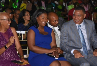 Prime Minister, the Most Hon. Andrew Holness (right), enjoys a light moment with Minister of Education and Youth, Hon. Fayval Williams (left) and Opposition Spokesperson on Youth and Civic Engagement, Senator Gabriela Morris (centre). Occasion was the 2023 Prime Minister’s National Youth Awards for Excellence ceremony held on the lawns of Jamaica House on April 20.