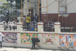 Volunteers participate in clean-up activities on Labour Day (May 23, 2024) at the Junior Centre of the Institute of Jamaica (IOJ) on East Street in downtown Kingston.