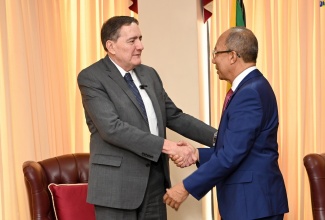 Deputy Prime Minister and Minister of National Security, Hon. Dr. Horace Chang (right) greets Director of the Pan-American Health Organization (PAHO) and World Health Organization (WHO) Regional Director for the Americas, Dr. Jarbas Barbosa da Silva Jr. during a courtesy call at the Office of the Prime Minister on Monday (May 6).