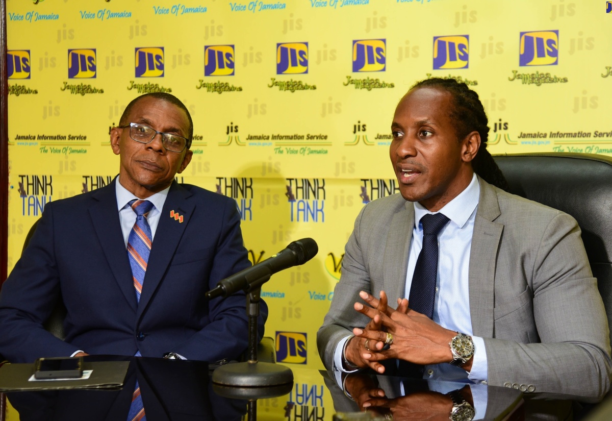 Minister of State in the Ministry of Foreign Affairs and Foreign Trade, Hon. Alando Terrelonge (right), speaks during the Jamaica Information Service (JIS) ‘Think Tank’ at the Agency’s head office in Kingston on Thursday (April 25).  Listening is Conference Chair, President and VM Group President and Chief Executive Officer, Courtney Campbell.

