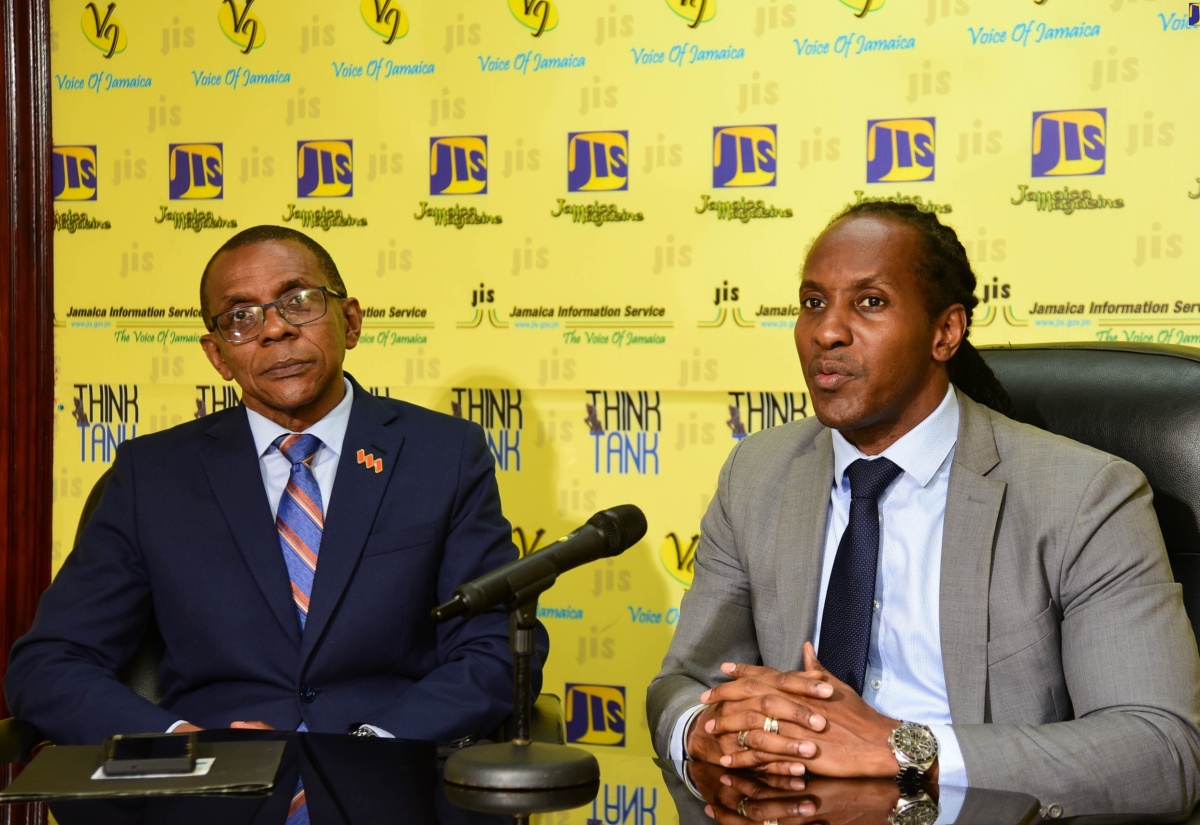 Minister of State in the Ministry of Foreign Affairs and Foreign Trade, Hon. Alando Terrelonge (right), addresses a recent Jamaica Information Service (JIS) Think Tank held at the agency’s head office in Kingston. Next to him is Chair of the Biennial Jamaica Diaspora Conference, President and Chief Executive Officer (CEO), VM Group, Courtney Campbell.