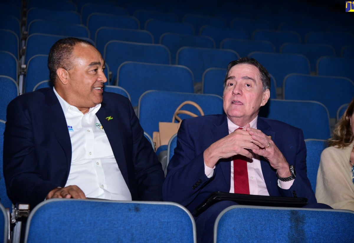 Minister of Health and Wellness, Dr. the Hon. Christopher Tufton (left), engages in light conversation with Director of the Pan American Health Organization (PAHO) and World Health Organization (WHO) Regional Director for the Americas, Dr. Jarbas Barbosa da Silva Jr. The occasion was the screening of a 30-minute documentary titled ‘Dying Young: Lifestyle Choices and the NCD Crisis’, highlighting the impact of non-communicable diseases (NCDs), at Courtleigh Auditorium in Kingston on Wednesday (May 8).

