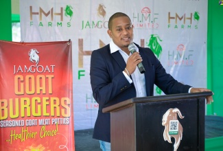 Minister of Agriculture, Fisheries and Mining, Hon. Floyd Green, addresses the launch of the Jamgoat Burger by HMN Farms Limited, held at the facility in  Bushy Park, St. Catherine on Saturday (May 4).