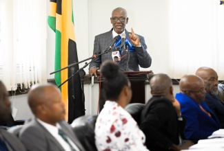 Minister of Local Government and Community Development, Hon. Desmond McKenzie, addresses the monthly meeting of the Portland Municipal Corporation,  in Port Antonio, on May 9.

