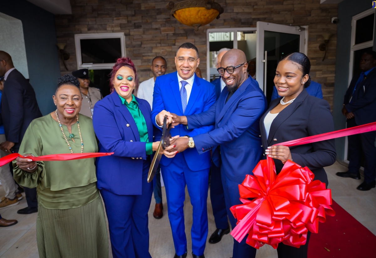 Prime Minister, the Most Hon. Andrew Holness (centre), cuts the ribbon to officially open Adam and Eve Day Spa’s new location on Old Hope Road in Kingston on Wednesday (May 15). Others (from left) are Minister of Culture, Gender, Entertainment and Sport, Hon. Olivia Grange; Managing Director, Adam and Eve Day Spa, Kimisha Walker; and Executive Chairman, Garth Walker; and Advisor to the Minister of Tourism, Paige Gordon. 
