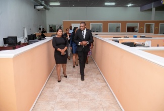 Minister without Portfolio in the Office of the Prime Minister with Responsibility for Information, Hon. Robert Morgan, converses with Editor in Chief, Times Media Group, Tusika Martin, during a tour of the media house’s facility in Guyana on Thursday (May 2). Minister Morgan is in Georgetown for UNESCO World Press Freedom Day observances.  

