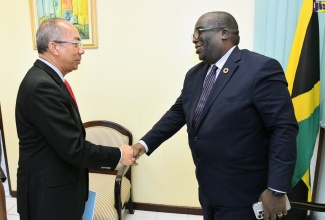 Deputy Prime Minister and Minister of National Security, Hon. Dr. Horace Chang (left), greets Resident Coordinator of the United Nations, Dennis Zulu, during his courtesy call at the Ministry’s offices in New Kingston on Wednesday (May 15).

