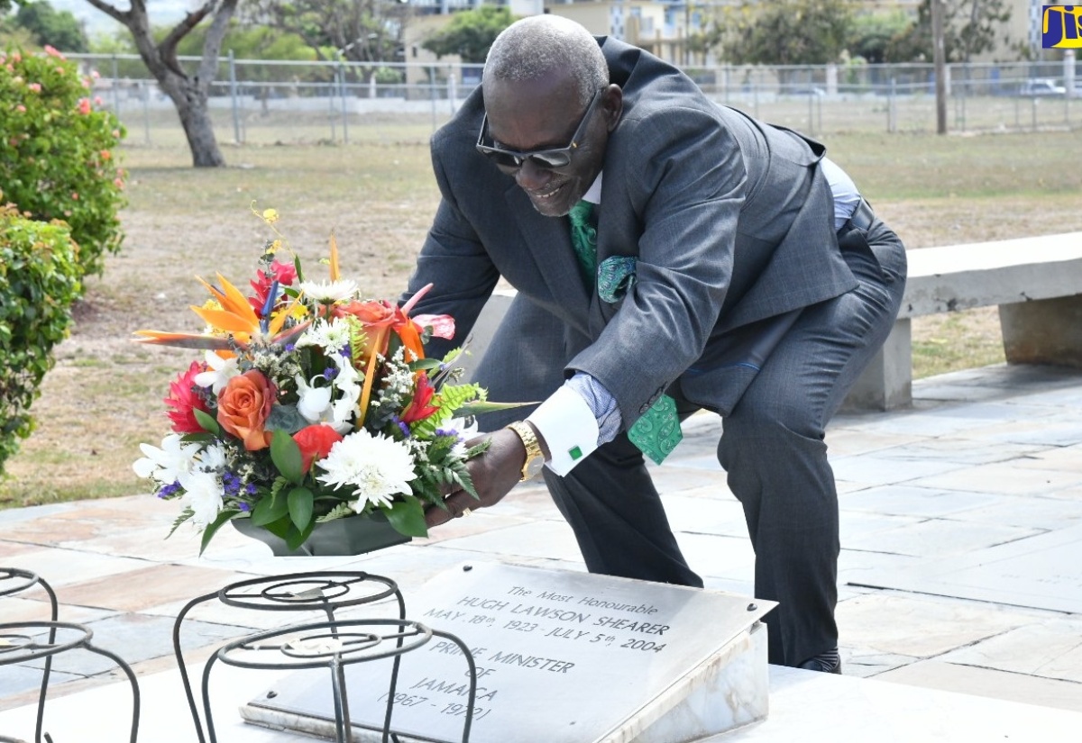Minister of Local Government and Community Development, Hon. Desmond McKenzie, lays flowers at the shrine of late former Prime Minister, the Most Hon. Hugh Lawson Shearer, at National Heroes Park in Kingston on Saturday (May 18). The occasion was a brief floral tribute ceremony commemorating the 101st anniversary of the birth of Mr. Shearer, who was Jamaica’s third Prime Minister.