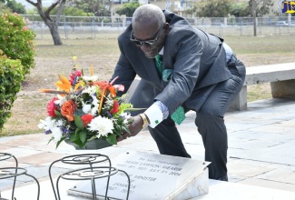 Minister of Local Government and Community Development, Hon. Desmond McKenzie, lays flowers at the shrine of late former Prime Minister, the Most Hon. Hugh Lawson Shearer, at National Heroes Park in Kingston on Saturday (May 18). The occasion was a brief floral tribute ceremony commemorating the 101st anniversary of the birth of Mr. Shearer, who was Jamaica’s third Prime Minister.