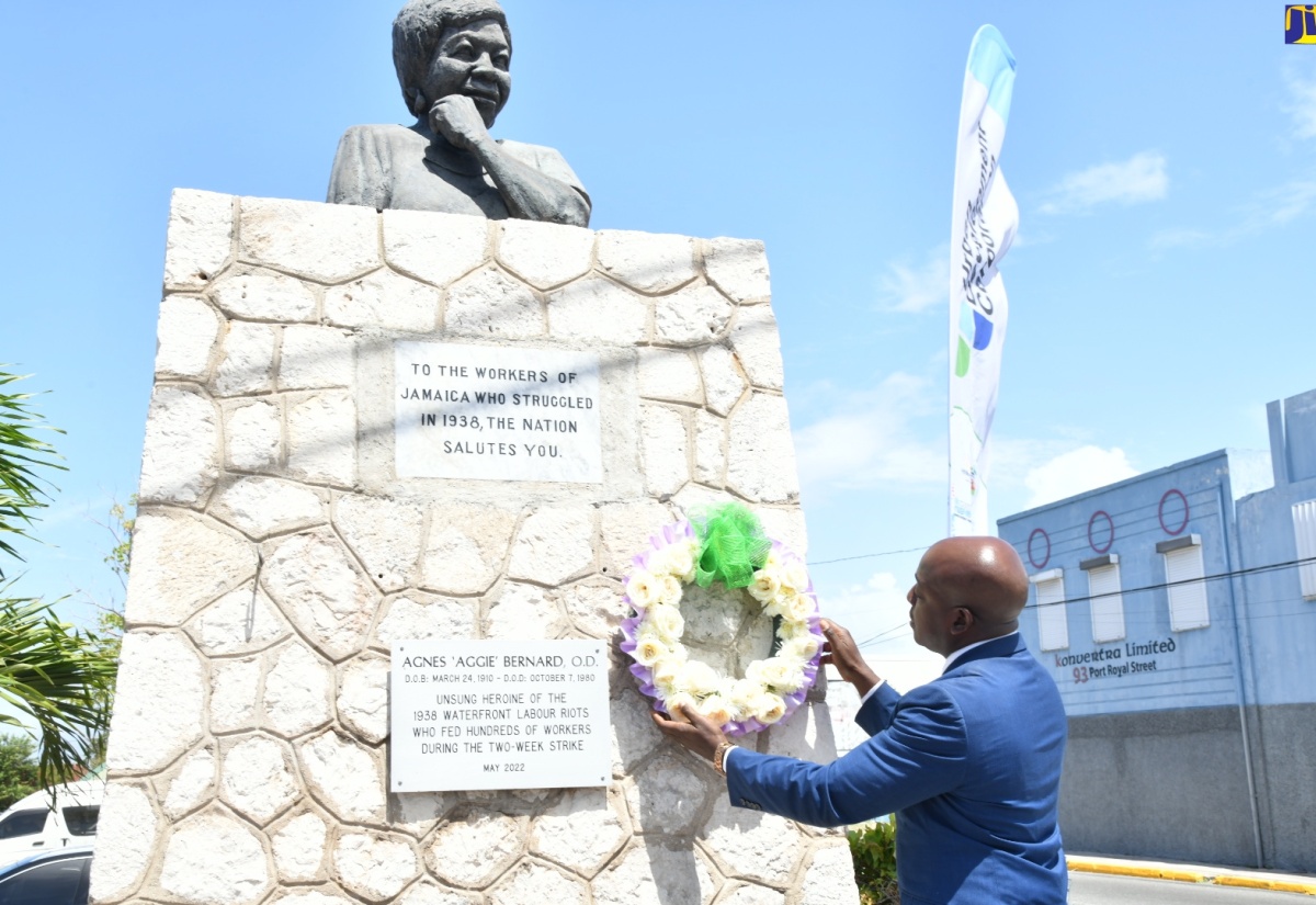 Minister of Labour and Social Security, Hon. Pearnel Charles Jr. places a wreath at the Agnes “Aggie” Benard Monument, downtown Kingston, during the National Workers’ Week/Labour Day wreath-laying ceremony on Tuesday (May 21) . The monument pays tribute to Jamaicans who participated in the 1938 labour strike, which have resulted in improved work conditions for today’s workers. National Workers’ Week, under the theme ‘Recognising abilities, fostering greater inclusion of our workers’, culminates with the observance on Labour Day on May 23.

