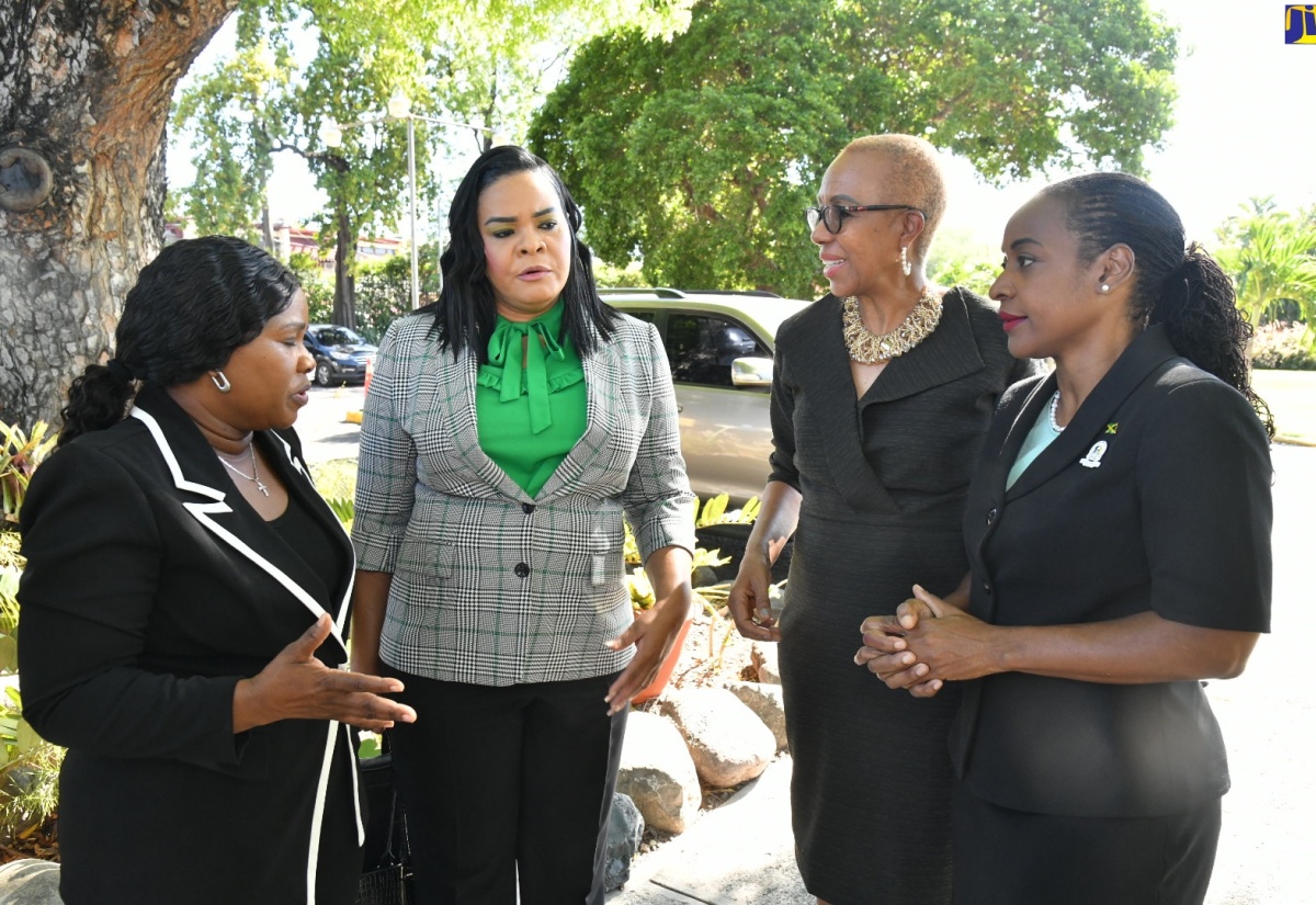 Minister of Education and Youth, Hon. Fayval Williams (second right), in discussion with (from left):Manager, Investigation Unit, Child Protection and Family Services Agency (CPFSA), Ericka Gilbert-Hope; Chief Executive Officer, CPFSA, Laurette Adams Thomas and Minister of State in the Ministry of Education and Youth, Hon. Marsha Smith, at the CPFSA ‘Ananda Alert Conference: Strengthening Responses to Missing Children’, at the Terra Nova All-Suite Hotel in St. Andrew, on May 24.
