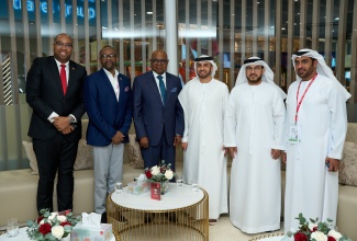 Minister of Tourism, Hon Edmund Bartlett, (2nd L) pauses for a photo following discussions with Senior Executives of Emirates Airline, Adman Kazim, Chief Commercial Officer (1st R), Sheikh Majid Al Mualla, Divisional Senior Vice President, International Affairs (2nd R) and Kahlid Bel Jaflah (R), Divisional Vice President Commercial Operations United Arab Emirates and Oman. Also pictured are Delano Seiveright, Senior Communications Strategist (L) and Director of Tourism, Donovan White. The meeting was held at Arabian Travel Market in Dubai on May 9, 2024.