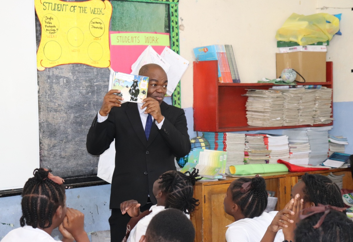 CEO at the National Environment & Planning Agency (NEPA), Mr. Leonard Francis, engages students at the St. Francis Primary and Infant School in a fun story titled 